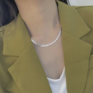 Close-up of S925 sterling silver pig nose anchor link choker on a fashion model