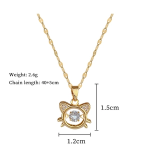 Golden cat pendant necklace with crystals showing dimensions 1.5cm by 1.2cm