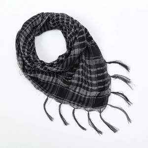 Detailed view of tactical shemagh scarf featuring black and grey woven patterns with tassels