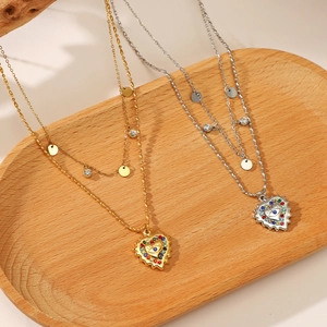 Double layered 14K gold heart necklace with colorful rhinestones and evil eye pendant
