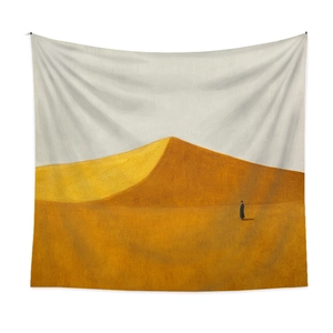 Detailed texture of bohemian tapestry featuring golden desert dunes and a lonely silhouette