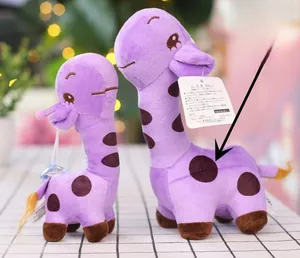 Detail of purple giraffe plush toy with digital print spots and soft fabric texture