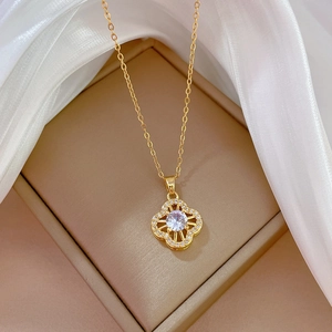 Macro shot of gold floral necklace with large zircon and small pavé crystals