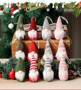 Detail view of plush Swedish Tomte gnome ornaments in various colors on a vintage box