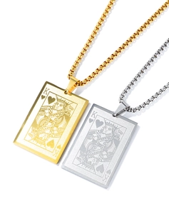 Detailed view of gold and silver poker King of Hearts pendants on stainless steel box chains