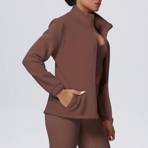 Detail view of deep brown fleece-lined zip jacket with stand collar and hidden side pockets