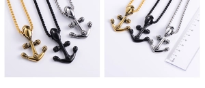 Detail view of skull anchor pendant size measurement with a ruler for punk necklaces