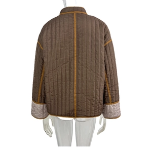 Rear view of women's quilted jacket in dark brown with mustard yellow trim details