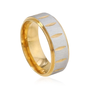 Macro detail of 8mm titanium steel ring with silver brushed finish and gold engraved patterns