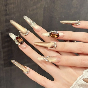 Brown cat-eye press-on nails with luxury gems and silver glitter for elegant style