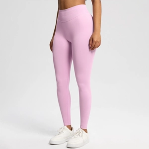 Close-up of seamless light pink yoga leggings with high-waisted wide compression waistband