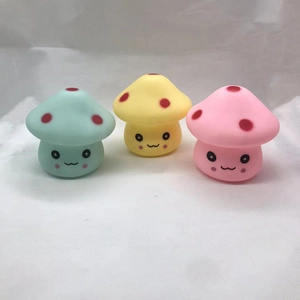 Three cute mushroom night lights in mint green, yellow, and pink with smiley faces