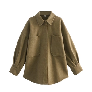 Detailed view of the olive green wool-like shirt jacket featuring front chest pockets