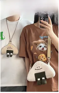 On-body view of plush rice ball crossbody and neck bags with cute embroidered expressions