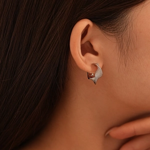 Minimalist silver twisted geometric hoop earrings with textured metal weave for women