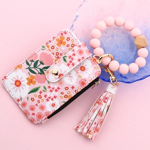 Pink floral PU leather card wallet with silicone beaded wristlet and tassel detail