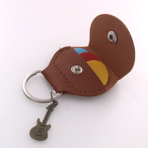 Brown leather guitar pick holder keychain with vintage guitar charm and three picks