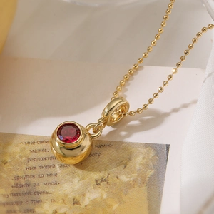 Minimalist gold plated necklace with a round red gemstone sphere pendant for women