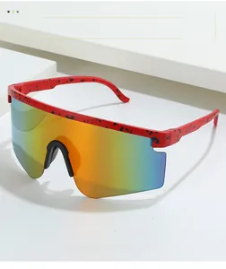 Detail of red frames with black speckled texture and large rainbow gradient lenses