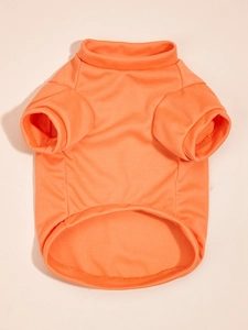 Close-up of bright orange pet t-shirt with ribbed crew neck and knit texture details