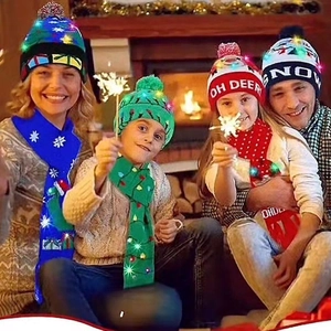 Detail of LED glowing Christmas knit hat and scarf set with family festive motif