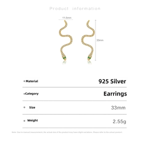 Detail view of 925 sterling silver snake earrings with white zircons and green gem eyes