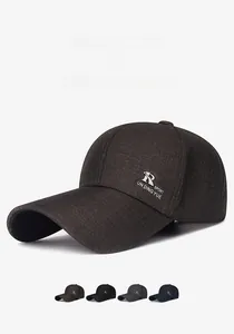 Detail of long-brimmed baseball cap showing textured fabric and side sport embroidery