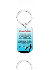 Detail view of rectangular metal keychain with silhouette of father and son and blue gradient
