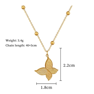 Détails du pendentif papillon doré avec dimensions et poids indiqués dans le texte