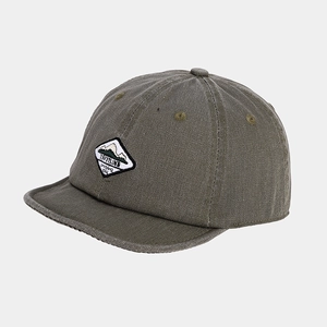 Detailed view of dark olive green short-brim baseball cap with mountain embroidery patch