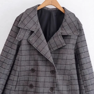 Women's classic dark grey plaid double-breasted coat in thick wool-like fabric on hanger