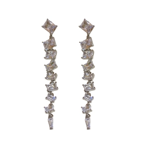 Elegant silver tassel earrings with square cubic zirconia stones on white background