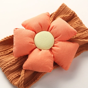 Soft nylon floral baby headband with an orange cotton flower and brown knitted band