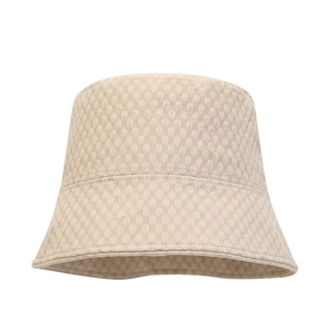 Detailed close-up showing the honeycomb texture and premium fabric of this beige bucket hat