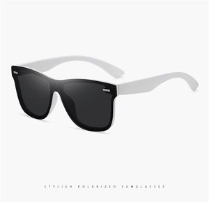 Close-up of polarized sunglasses with black frames and white temples from a 45-degree angle