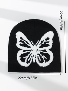 Close-up showing 22cm by 22cm dimensions for the black knit beanie with butterfly pattern