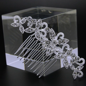 Detailed view of bridal silver flower hair comb with sparkling rhinestones and clear crystals