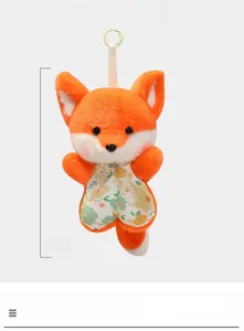 Detail showing 16cm orange fox plush toy with floral clothes and white hanging loop