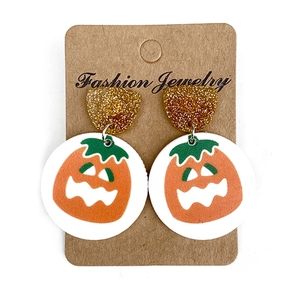 Halloween pumpkin earrings with gold glitter detail on card for spooky season style