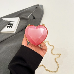 Mini pink heart-shaped hard shell chain crossbody bag with 3D geometric facets