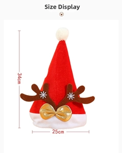 Detailed view of red velvet Christmas hat with antlers, golden bow and size dimensions