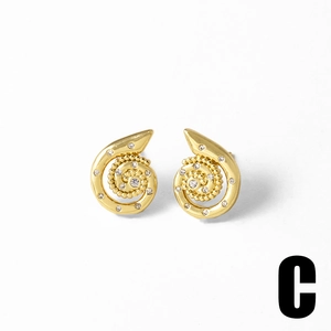 Macro detail of gold-plated spiral nautilus earrings with inset clear zircon stones