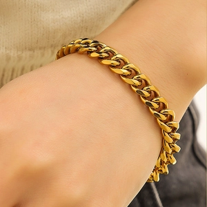 Classic gold stainless steel Cuban link bracelet for men showing a sleek hip hop style