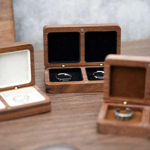 Macro shot of dark walnut wood jewelry box with soft lining and fine natural grain