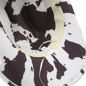 Close-up of cowboy hat interior showing 100% polyester label and adjustable strap