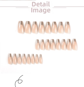 Detail view of French press-on nails with nude base and silver glitter tips in various sizes