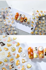 Close-up of 3D embossed nail stickers featuring cute shiba inu and cartoon animals MN-040