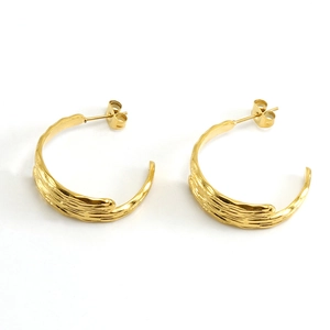 Golden titanium steel hoop earrings with textured bark design and 18k gold plating