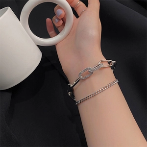 Silver layered chain bracelet set with pavé rhinestones and minimalist metal link design