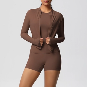 Detail of high-stretch cocoa yoga set with zipper jacket and thumbhole cuffs